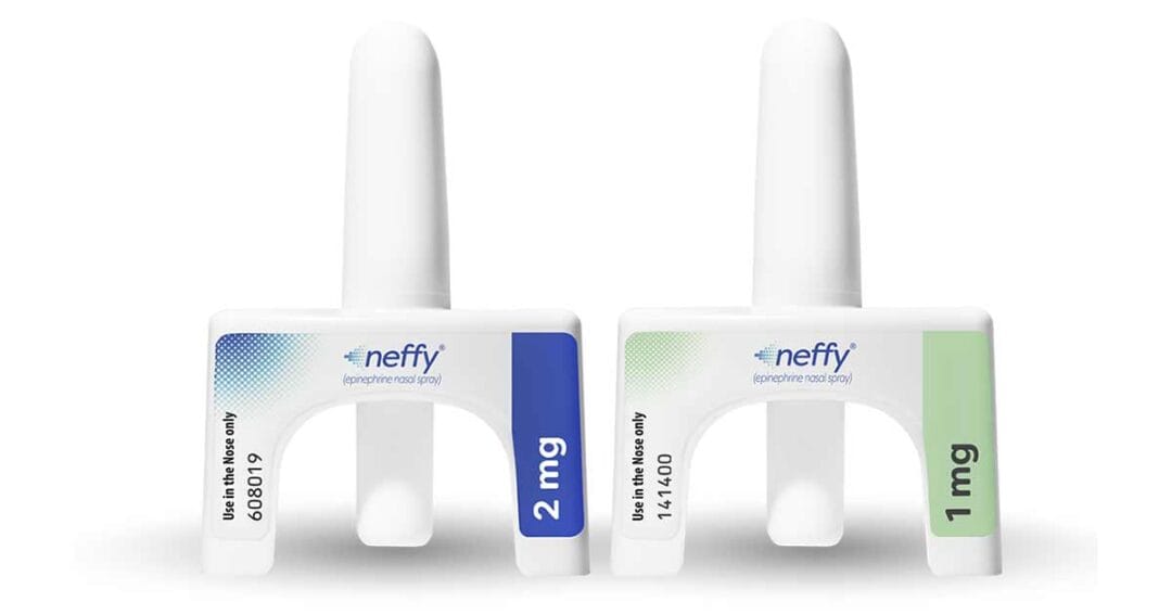 Anaphylaxis 7 Two neffy epinephrine nasal sprays are shown upright. The left device has a blue label with “2 mg,” and the right device has a green label with “1 mg.” Both clearly state “Use in the Nose only.”.