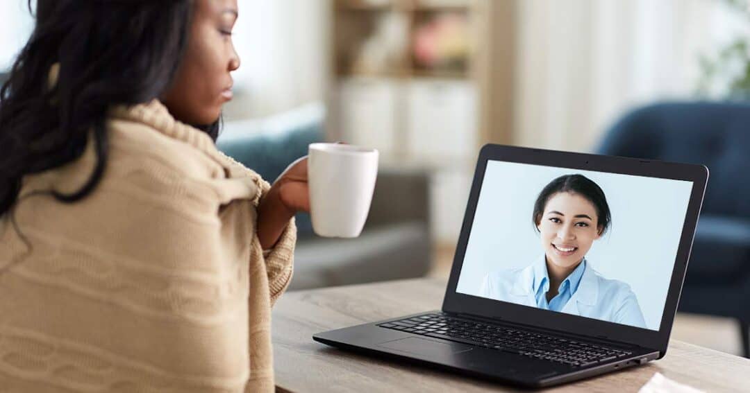 Free Asthma Coach Program 1 a women resting at home speaking to her online asthma coach on her laptop.